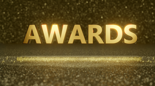 image of the word awards in gold representing custom company rings and how awarding employees makes for a lasting impression.
